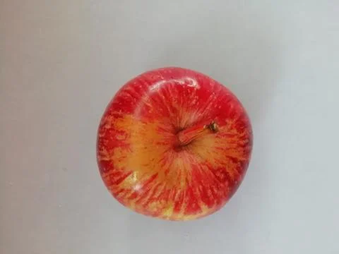 A Single apple isolated on a floor Foto stock