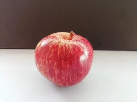 A Single apple isolated on a floor Foto stock