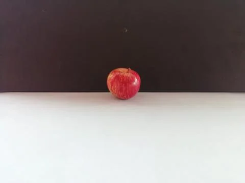 A Single apple isolated on a floor Stock Photos