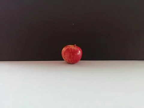A Single apple isolated on a floor Stock Photos