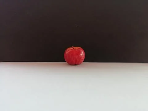 A Single apple isolated on a floor Stock Photos