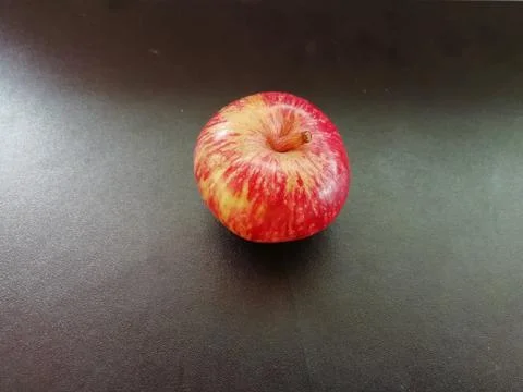A Single apple isolated on a floor Stock Photos