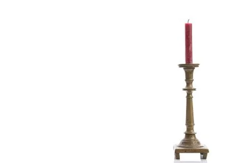 Single arm candlestick made of brass made in old decorative style, isolated on a Stock Photos