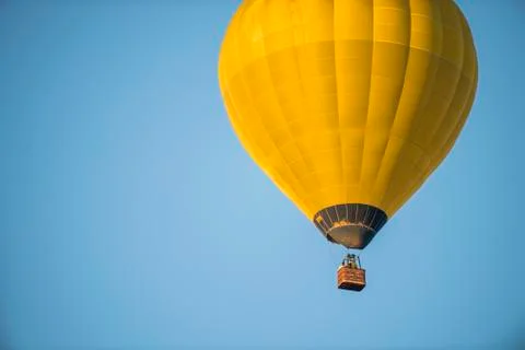A single balloon on a blue sky Stock Photos