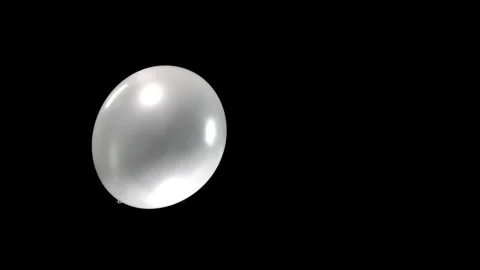 Single Balloon Falling Gracefully in a Simple, Serene Descent, Green Screen Stock Footage 303578303