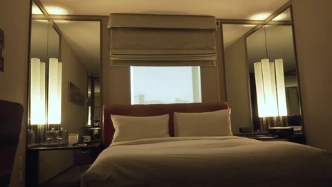 Single bed in a small hotel room Stock Footage 87266316