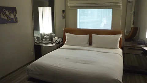Single bed in a small hotel room Video stock 87274505