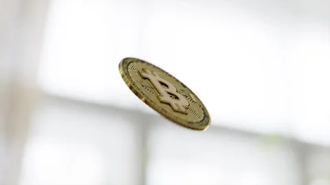 Single bitcoin in the air Stock Footage 253589334