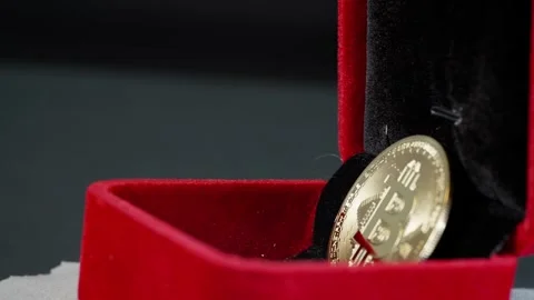 Single Bitcoin Displayed in Rotating Jewelry Box Stock Footage 297264773