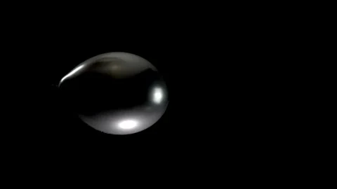 Single Black Balloon Falling Steadily from Top to Bottom Against a Dark Stock Footage 304863769