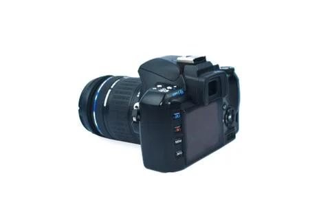 Single black colored digital camera with a nice lens attached to it on top of Stock Photos