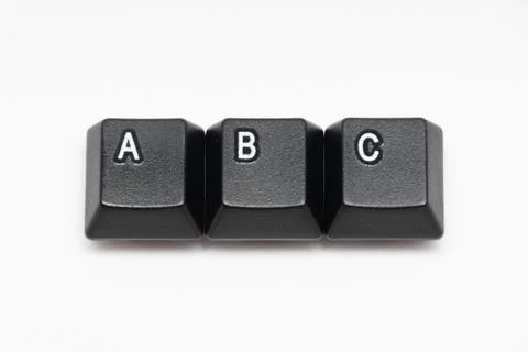 Single black keys of keyboard with different letters ABC Stock Photos