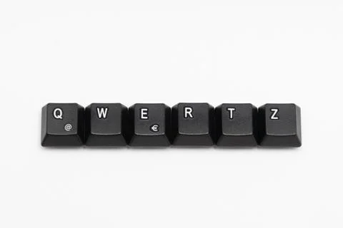 Single black keys of keyboard with different letters QWERTZ Stock Photos