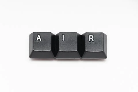 Single black keys of keyboard with different letters AIR Stock Photos