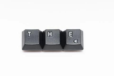 Single black keys of keyboard with different letters THE Stock Photos
