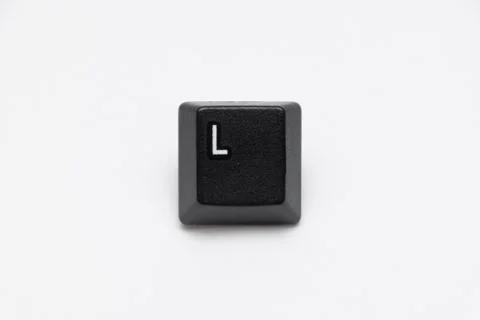 Single black keys of keyboard with different letters L Stock Photos