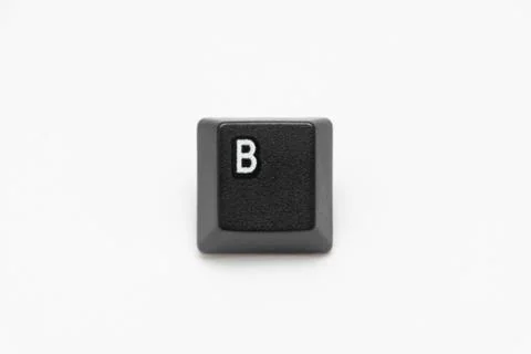 Single black keys of keyboard with different letters B Stock Photos