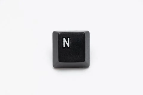 Single black keys of keyboard with different letters N Stock Photos