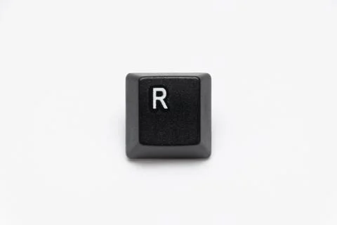 Single black keys of keyboard with different letters R Stock Photos