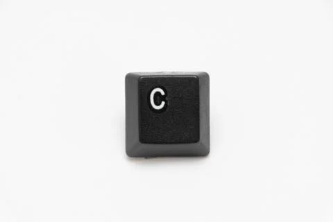 Single black keys of keyboard with different letters C Stock Photos