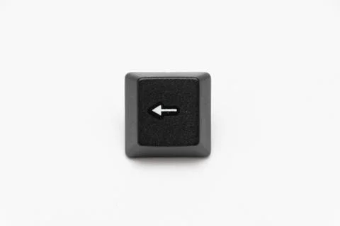 Single black keys of keyboard with different letters left arrow Stock Photos
