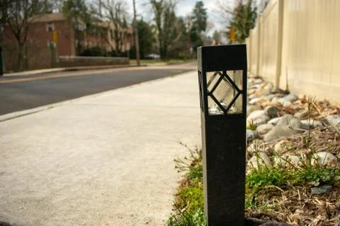 A Single Black Path Light in a Patch of Grass on a Street in Suburban Pennsyl Stock Photos