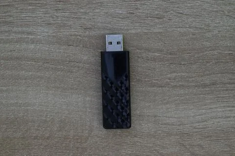 Single black USB flash drive on wood Stock Photos
