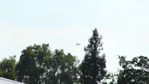 Single Blue Angel FA - 18A Fighter Jet Fly's through Tree Line Video stock 160447524