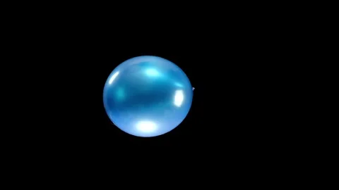 Single Blue Balloon Falling in Slow Motion with Clear Background and Smooth Stock Footage 303633056