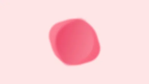 A single blurred red circle floating on a clean and bright white background Video stock 335117817