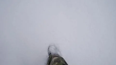 Single Boot Sinking Into Fresh Snow, Camouflage Pant Leg Visible And Impression Stock Photos
