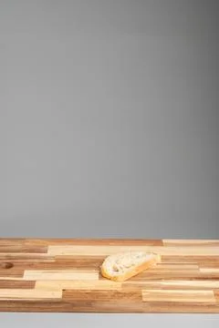 Single Bread Slice on Wooden Surface Foto stock