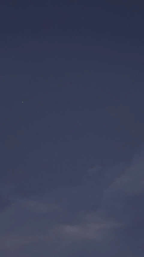 Single Bright Point of Light in Dark Blue Twilight Sky Video stock 344717268