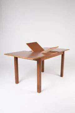 Single brown folding table with empty surface on an isolated white background Stock Photos