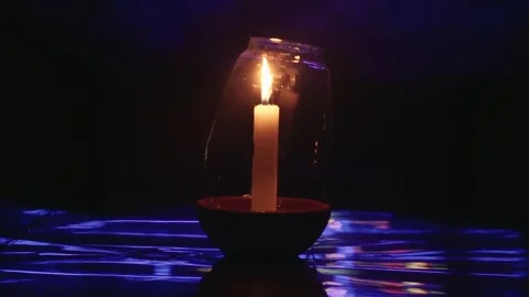 Single burning candle creating a serene meditative atmosphere Stock Footage 345897357