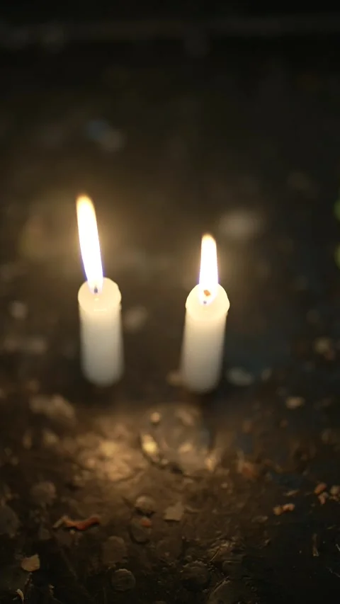 Single Burning Candle in Dim Religious Setting Stock Footage 312747031