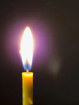 Single Burning Candle Flame on Dark Background Stock Photos