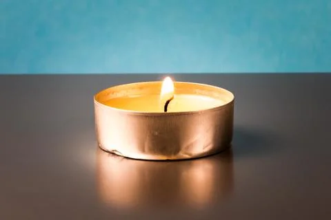 Single burning candle Stock Photos