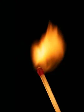 SINGLE BURNING MATCH Stock Photos
