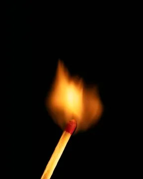 SINGLE BURNING MATCH Stock Photos