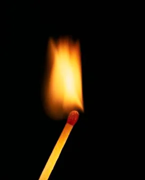 SINGLE BURNING MATCH Stock Photos