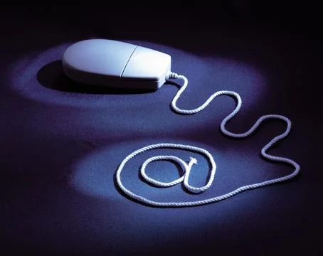 Single button mouse with wire form an at sign Stock Photos