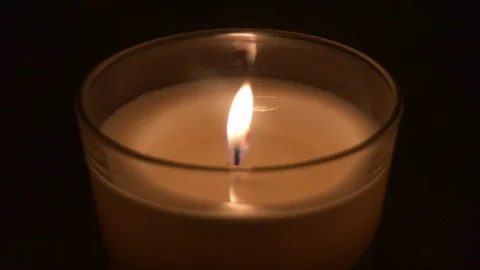 Single Candle Burning in Dark Stock Footage 100610229