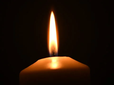 Single candle burning, isolated on black background. Stock Footage 74793614