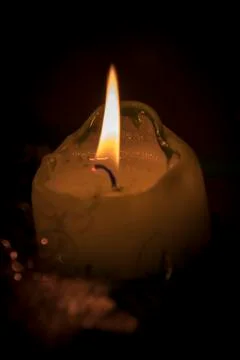 Single candle up close Foto stock