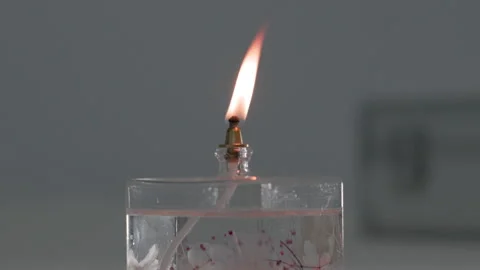 Single Candle Flame Burning Against Dark Background Stock Footage 340243660