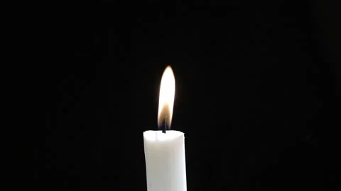 A Single Candle is Lit on Black Background. White candle burning. Stock-Footage 146491131