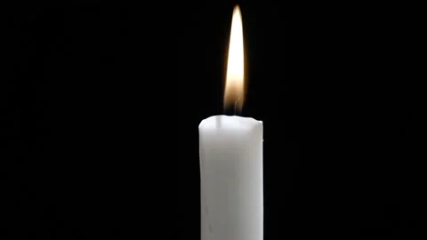 A Single Candle is Lit on Black Background. White candle burning. 스톡 동영상 146491145