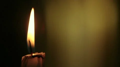 Single candle lit then blow out slowly Stock Footage
