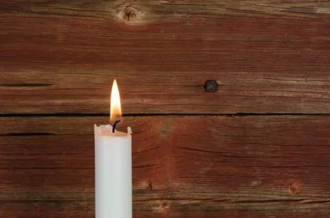 Single candlelight at old wall Stock Photos